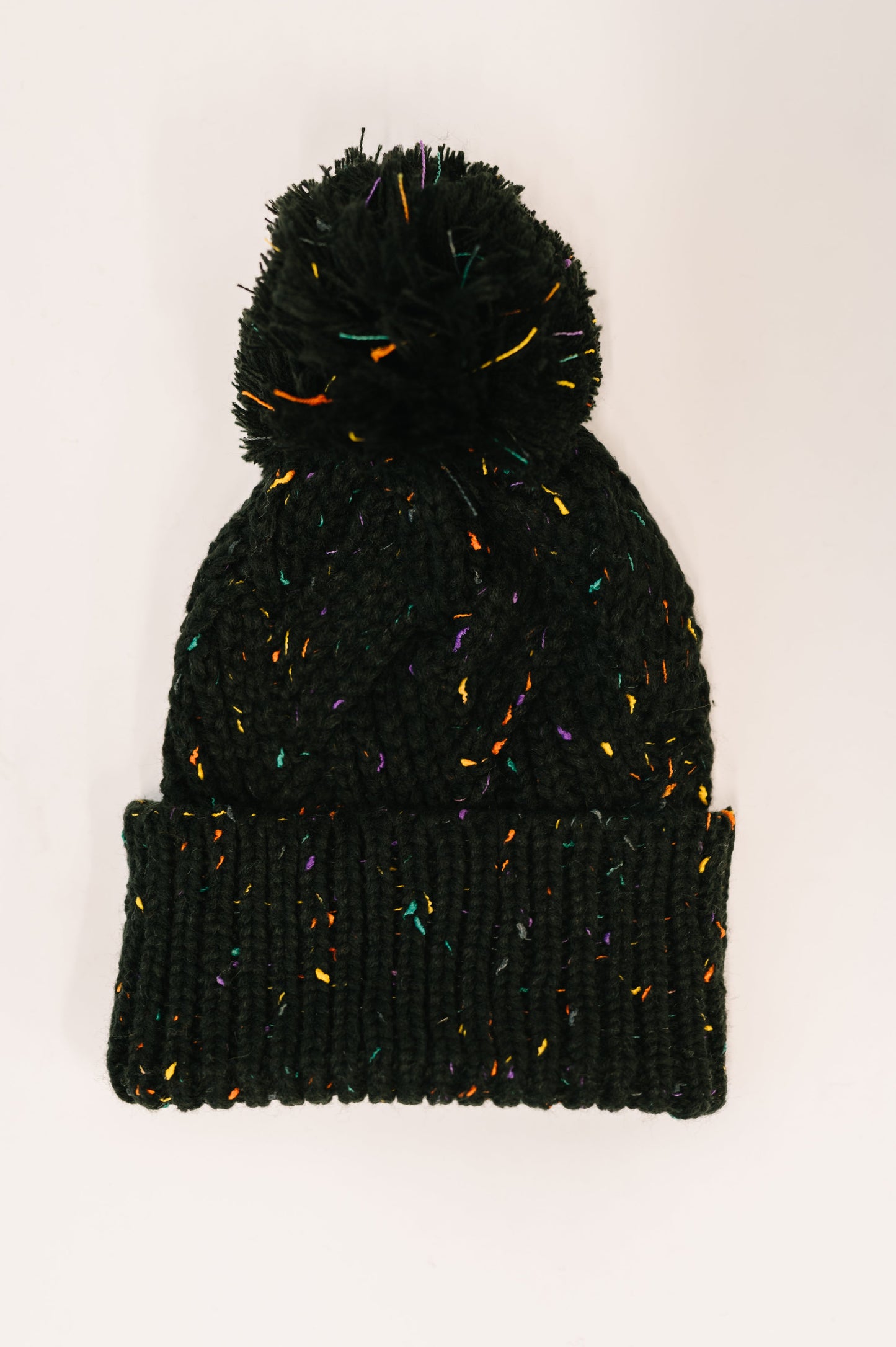 Cover Your Ears Pom Pom Beanie in Black at Curbside Boutique
