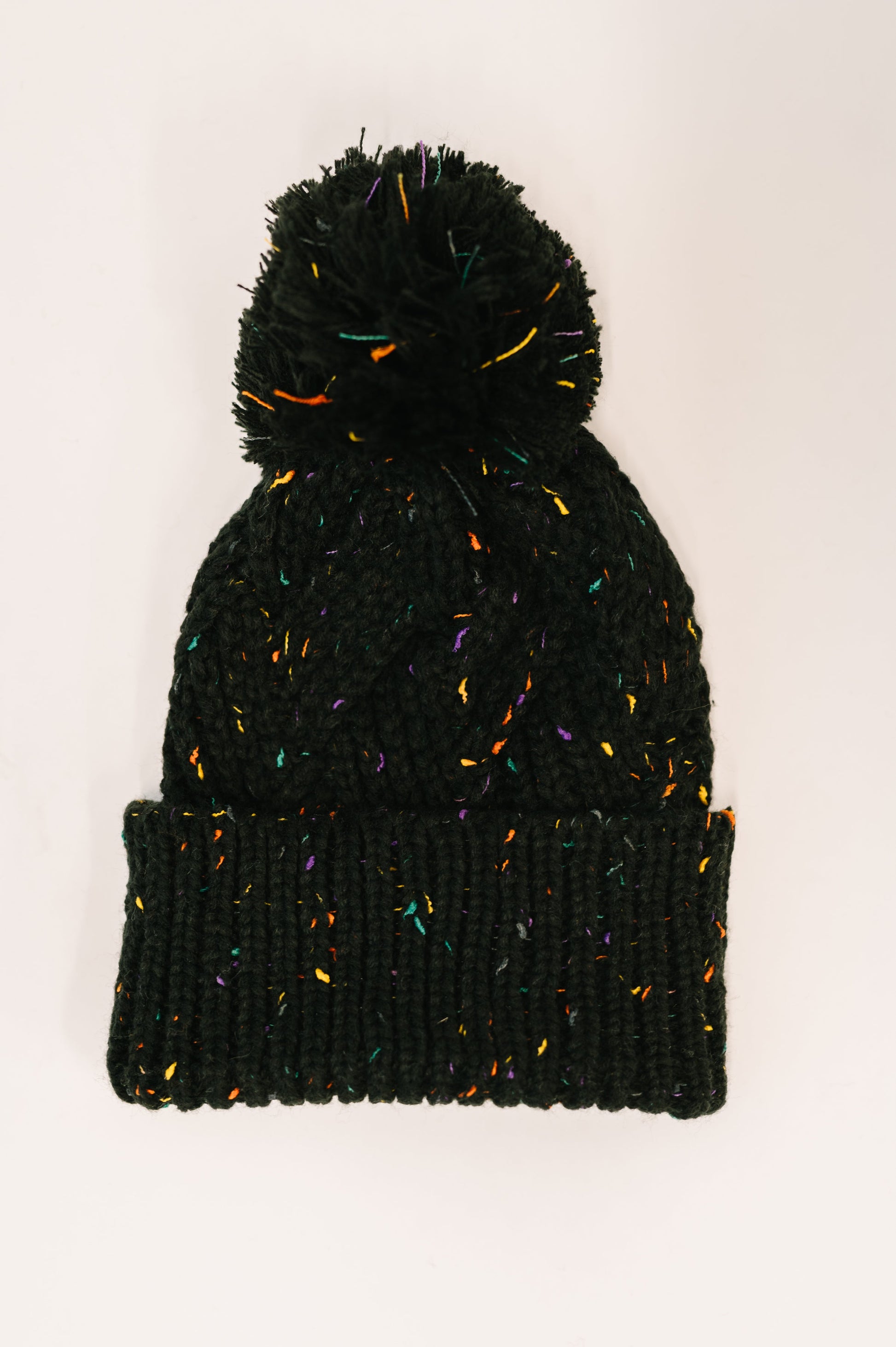 Cover Your Ears Pom Pom Beanie in Black at Curbside Boutique
